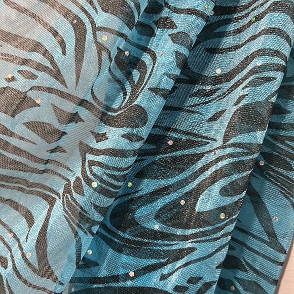 Sheer blue zebra print scarf very lightweight. Fringe trimmed. 100% Polyester - Picture 4 of 4